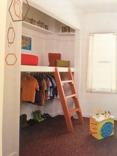 a room with a bunk bed and a ladder to the top floor, next to a window