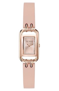 Sparkling crystals light up the sunray dial on this rectangular watch featuring a two-hand quartz movement and a smooth leather strap 8mm x 12mm case Buckle closure Quartz movement Mineral crystal face Stainless steel/leather Imported Evening Watch With Leather Strap And Rectangular Dial, Evening Watches With Leather Strap And Rectangular Dial, Leather Watch With Rectangular Dial For Evening, Leather Watches With Rectangular Dial For Evening, Rectangular Leather Strap Watch For Work, Rose Gold Rectangular Watch With Bracelet Strap, Rectangular Rose Gold Watch With Bracelet Strap, Rectangular Watch, Leather Strap Watch