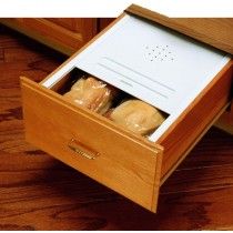 an open drawer with some bread in it