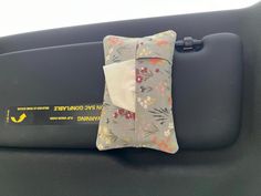 the back seat of a car with a pillow on it