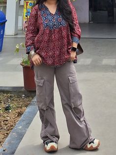 @s1m_s2  indo west college fit Short Kurtis For College Wear, Short Kurti With Cargo Pants, Kurti With Cargo Pants, Girls College Outfits, India Outfits Travel Style, Outfit Ideas Joggers, Short Kurti With Jeans Outfit, College Fits Aesthetic, Desi College Outfits