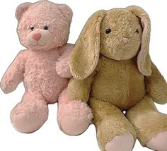 two stuffed animals sitting next to each other on a white background, one pink and one brown