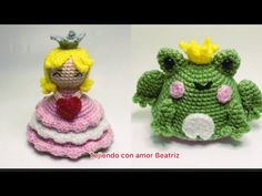 two crocheted dolls sitting next to each other on a white surface, one wearing a princess dress and the other in a frog costume