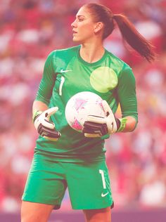 a woman in green uniform holding a soccer ball with the caption, if your girlfriend looks like this she's probably a keeper