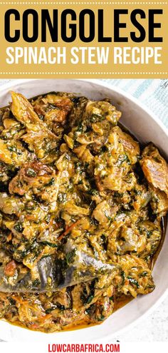 a bowl filled with spinach stew on top of a table