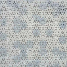 a white and blue flower pattern is shown in this image, it appears to be very intricate