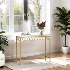 a living room scene with focus on the console table and potted plant next to it