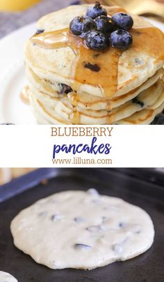 pancakes with blueberries and maple syrup are on a plate next to a pancake