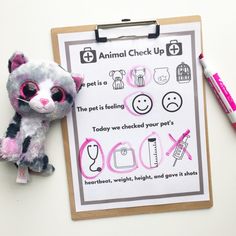 a stuffed animal next to a clipboard with instructions on how to get a pet