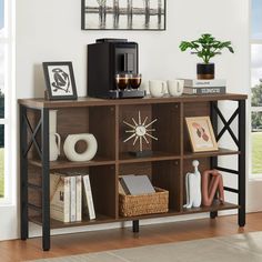 a coffee maker on top of a wooden shelf