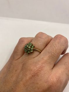 Rich and very bright Peridot green ring Sterling silver with rhodium finish Size 7 can be sized by my jeweler. His service charge is $10 All rings are shipped in a nice gift box. Check out our over a THOUSAND great reviews!!! Engraving is $4 per letter and is not always perfect depending on the piece. It can take a few days if the jeweler is busy. This is payable to Paypal Judithsltd@gmail.com Fine Jewelry Green Multi-stone Emerald Ring, Green Multi-stone Emerald Ring Fine Jewelry, Green Sterling Silver Rings With Prong Setting, Green Multi-stone Emerald Ring For May Birthstone, Green Multi-stone Emerald Rings, Green Cluster Ring For Weddings, Green Emerald Cluster Ring With Multi-stones, Cluster Green Emerald Ring For Wedding, Green Peridot Jewelry For Gift