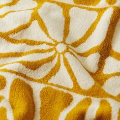 an orange and white blanket with circles on it