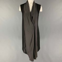 Lutz Huelle Dress Comes In A Black & Charcoal Mixed Materials Featuring A Front Draped Design, Single Snap Button Detail, And A Side Zipper Closure. Very Good Pre-Owned Condition. Marked: 40 Measurements: Shoulder: 15 Inches Bust: 36 Inches Waist: 36 Inches Length: 36 Inches Sui Generis Reference: 121630 Category: Dress More Details Brand: Lutz Huelle Gender: Female Size: 4 Color: Black & Charcoal Fabric: Wool Material: Mixed Fabrics Style: Sleeveless Age Group: Adult Sui Generis Designer Consignment Is An Award Winning Fashion Resale Store For Women & Men. Located In San Francisco. The New York Times, Gq, Refinery29, Goop, Forbes And More Have Recognized Black Asymmetrical Silk Dress, Black Asymmetrical Silk Midi Dress, Black Silk Sleeveless Dress For Evening, Elegant Sleeveless Dress For Layering, Black V-neck Dress For Layering, Chic Black Sleeveless Silk Dress, Black Draped Dress For Work, Black Asymmetrical Sleeveless Evening Dress, Knee-length Black Dress For Layering