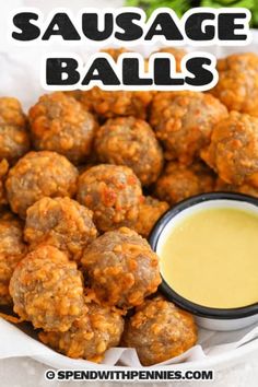 a bowl full of sausage balls with dipping sauce in the middle and text overlay that reads, sausage balls