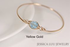 Rose Gold Aquamarine Swarovski Crystal Bracelet Handmade by Jessica Luu Jewelry ~ Faceted ~ Versatile ~ Elegant ~ With every wave of your hand, there will be a sparkle at your wrist as this bangle moves around. Aquamarine is March's birthstone. MATCHING ITEMS https://www.etsy.com/shop/JessicaLuuJewelry?ref=seller-platform-mcnav&search_query=aquamarine MATERIALS: ~ 10mm aquamarine Swarovski crystal ~ 14K gold filled wire HOW IT'S MADE: A large Swarovski crystal is wire wrapped in a herringbon Fork Necklace, Wire Bracelets Diy, Diy Wire Jewelry Rings, Wire Jewelry Earrings, Wire Jewelry Rings, Wire Wrapped Stone Jewelry, Crystal Stone Jewelry, Beaded Memory Wire Bracelets, Jewelry Rose Gold