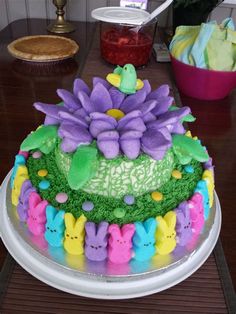 there is a cake decorated with flowers and peep holes on the top of it