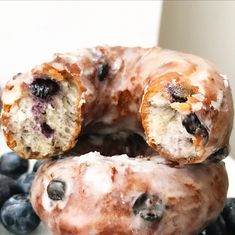 two blueberry donuts stacked on top of each other