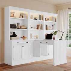 a white desk and bookcase in a room