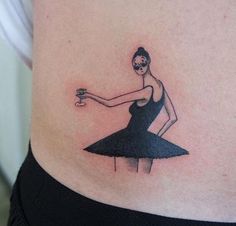 a woman in a black dress holding a glass of wine on her stomach with a skull tattooed on the side