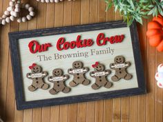 a sign that says our cookie crew the browning family is decorated with gingerbread men