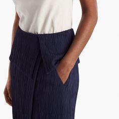 Sizing tip: This skirt runs large. Our stylists recommend ordering one size down. Inspired by classic tuxedo details, this sophisticated skirt features an angular, folded waist detail that creates a peplum-like silhouette. This season, we’ve updated it in a luxurious Italian knit with a pleated texture that allows for shaping and contouring in all the right places. Besom pockets add a little shine, while a secure underlayer keeps you feeling secured and well-covered. Elegant Midi Skirt For Office, Elegant High Waist Fitted Skirt, Chic Tailored Structured Bottoms, Elegant High Waist Formal Skirt, Modern Lined Skirt For Office, Elegant Lined Skirt For Semi-formal Occasions, Formal Lined Skirt For Summer, Chic Semi-formal Relaxed Pencil Skirt, Chic Semi-formal Spring Pencil Skirt