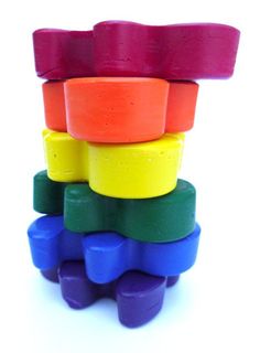 a stack of colorful plastic toys on a white background