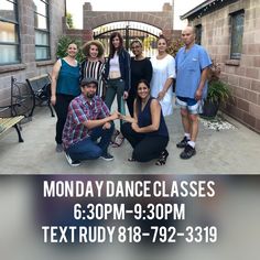 a group of people posing for a photo in front of a building with the words monday dance classes 6 30pm - 9 00pm