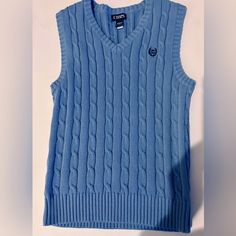 In Excellent Condition . Nwot. Blue Sleeveless Knit Sweater, Blue Sleeveless Casual Sweater, Casual Blue Winter Tank Top, Blue Casual Sleeveless Sweater Vest, Casual Blue Tank Top For Winter, Blue Sleeveless Winter Top, Blue Sleeveless Top For Winter, Fitted Sleeveless Blue Sweater, Blue Cotton Sleeveless Sweater Vest