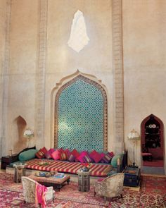 a living room filled with lots of colorful furniture