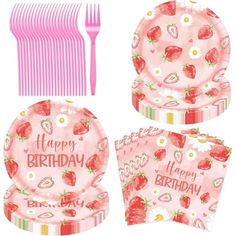 a set of pink plates and forks with strawberries printed on the plate, along with matching napkins