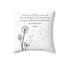 a white pillow with a dandelion on the front and poem written in black