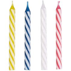 four different colored candles are lined up in a row