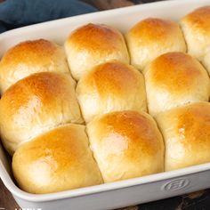 rolls in a white baking dish ready to be baked into buns or breadsticks