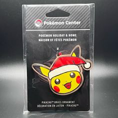 a pokemon holiday and home magnet with a pikachu's hat on it