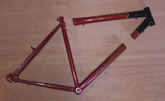 two red frames laying on top of a wooden table