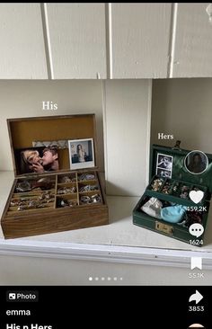 an open box with pictures and other items in it on a shelf next to another box