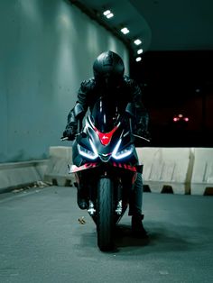 a man riding on the back of a motorcycle