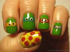 teenage mutant nail art with green and red polka dots, googly eyes and an orange turtle