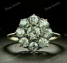 an antique diamond cluster ring, set in 18ct yellow gold and featuring old cut diamonds