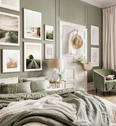 a bedroom with green walls and pictures on the wall above the bed, along with a chair