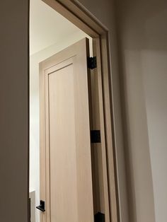 an open wooden door in a room