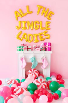 all the jungle ladies balloons and stockings are on display in front of a pink wall