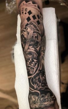 a man's arm with tattoos on it