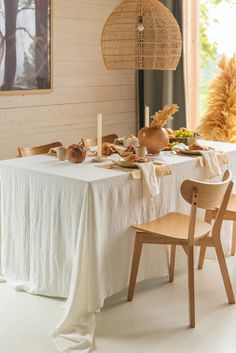 the table is set with food and candles