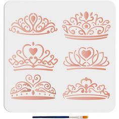 the stencil set includes princess crowns, hearts and arrows in pink on a white background