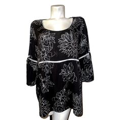 Add A Touch Of Elegance To Your Wardrobe With This Stunning Black And White Floral Belled Sleeve Tunic From Suzanne Betro. The Collarless Blouse Features A Scoop Neckline, Pullover Closure And 3/4 Sleeves For A Comfortable Fit. Made Of Lightweight And Breathable Rayon Material, This Blouse Is Perfect For All Seasons And Occasions, Including Travel, Weddings, Casual Outings And Business Meetings. The Plus-Size Blouse Is Machine Washable And Comes In A Regular Fit. It Boasts Colorful Flower Design Fitted Black Tunic For Spring, Black Fitted Summer Tunic, Elegant Fitted Black Tunic, Black Fitted Elegant Tunic, Fitted Black Long Sleeve Tunic, Black Floral Print Top With 3/4 Sleeves, Black And White Floral, White Halter Maxi Dress, Sheer Blouse