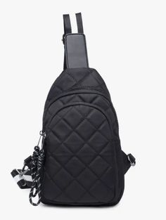 Black Quilted Sling Bag Material: Nylon- Hardware is Silver Details: Dimensions: 6.7" l x 4.3" w x 10.6" h • Weight: 1 lb Strap is Black and White stripe. ***This item is a pre-order item. Trendy Nylon Shoulder Bag With Cell Phone Pocket, Nylon Shoulder Bag Backpack, Nylon Shoulder Bag Backpack With Cell Phone Pocket, Nylon Backpack With Cell Phone Pocket, Black Nylon Bags, Black Satchel Chest Bag With Detachable Strap, Portable Black Nylon Bags, Portable Nylon Chest Shoulder Bag, Black Nylon Shoulder Bag With Mobile Phone Pocket