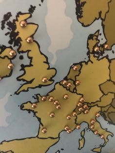 gold studs on the map of europe are seen in this photo taken from above