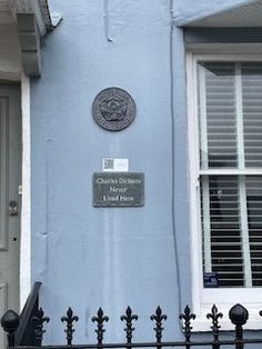 a blue building with a sign on it