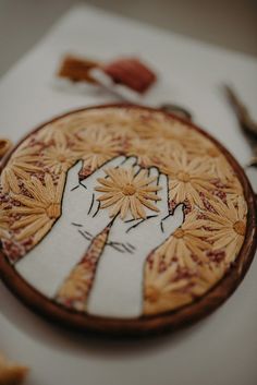 a close up of a wooden plate with designs on it